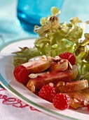 Chicken breast with oak leaf lettuce and raspberries