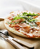 Pizza with parma ham and rocket