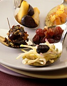 Various appetisers on spoons