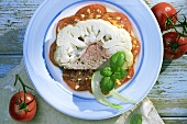 Cauliflower with mince filling on sliced tomato 