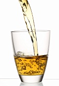 Pouring apple juice into a glass