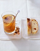 Tea punch with ginger and star anise, with sliced yeast bun