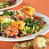 Mixed salad leaves with shrimps and fruit