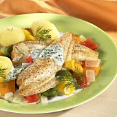 Plaice fillet with boiled potatoes & dill on vegetables