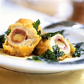 Breaded veal rolls with ham and cheese stuffing