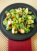 Corn salad with broad beans, potatoes and anchovies