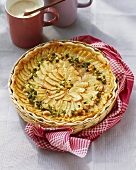 Apple and marzipan tart with nuts and pistachios