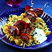 Grilled lamb kebabs on couscous