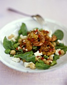 Barbecued shrimps on spinach salad