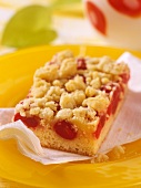 A piece of cherry crumble cake