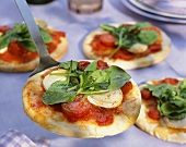Tomato and cheese mini-pizzas with sorrel