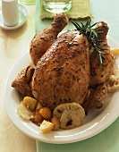 Whole rosemary chicken with garlic and potatoes