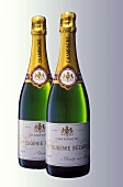 Two bottles of Veuve Eugenie Bezard champagne side by side