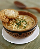 Parsnip and swede soup with almonds, pastry snail