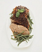 Leg of lamb with herb crust and green beans