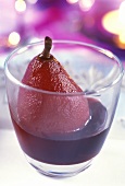 Red wine pear, served in a glass