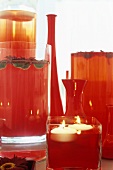 Red vases and floating candles (table or party decorations)
