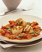 Scallops on tomato sauce