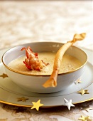 Parmesan soup with cooked crab tails