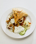 Turkey gyros in flatbread with cabbage salad and tsatziki