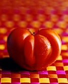 Tomato on checked background