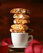 Cantucci biscuits piled on a coffee cup