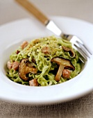Green tagliatelle with mushrooms and pancetta (bacon)