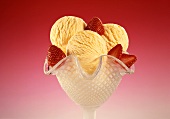 Ice cream sundae: 3 scoops of vanilla ice cream & strawberries