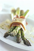Boiled green asparagus with ham