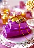 Christmas table setting in violet and gold