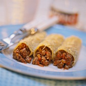 Three cannelloni (pasta rolls filled with mince)