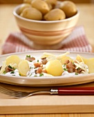 Boiled potatoes with matje herring and cream sauce