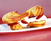 Éclair with strawberry and cream filling