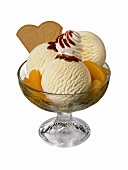 Sundae: vanilla ice cream, peaches, cream & strawberry sauce