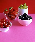 Redcurrants, blackberries, gooseberries & strawberries in bowls