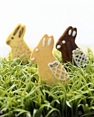 Three sweet pastry bunnies on Easter grass
