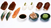 Still life with sushi ingredients (fish, rice, wasabi paste)