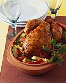 Stuffed chicken with vegetables, cooked in Römertopf
