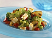 Vegetable salad with grilled sheep's cheese
