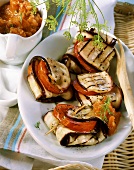 Barbecued aubergine parcels with tomato sauce