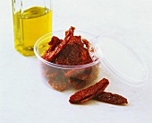 Dried tomatoes (dried in the oven) and oil (for bottling)