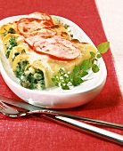 Baked cannelloni with fish and herb filling