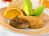 Steaks of young venison with stout zabaione and oranges