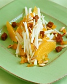 Kohlrabi salad with oranges, pine nuts and croutons