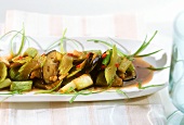 Wok-cooked aubergines with celery and spring onions