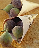 Fresh figs in newspaper bags