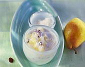 Yoghurt muesli with grated coconut and pear