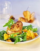 Pork fillet on rocket with physalis and oranges