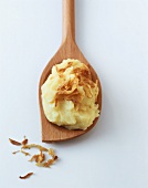 A spoonful of apple puree with fried onions