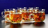 Vegetable broth in glass cups in a microwave